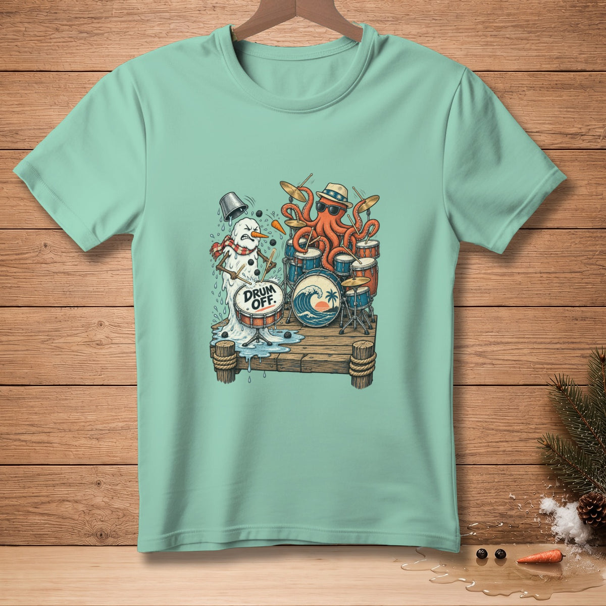 T-shirt graphic of a melting snowman and octopus playing drums on a pier.