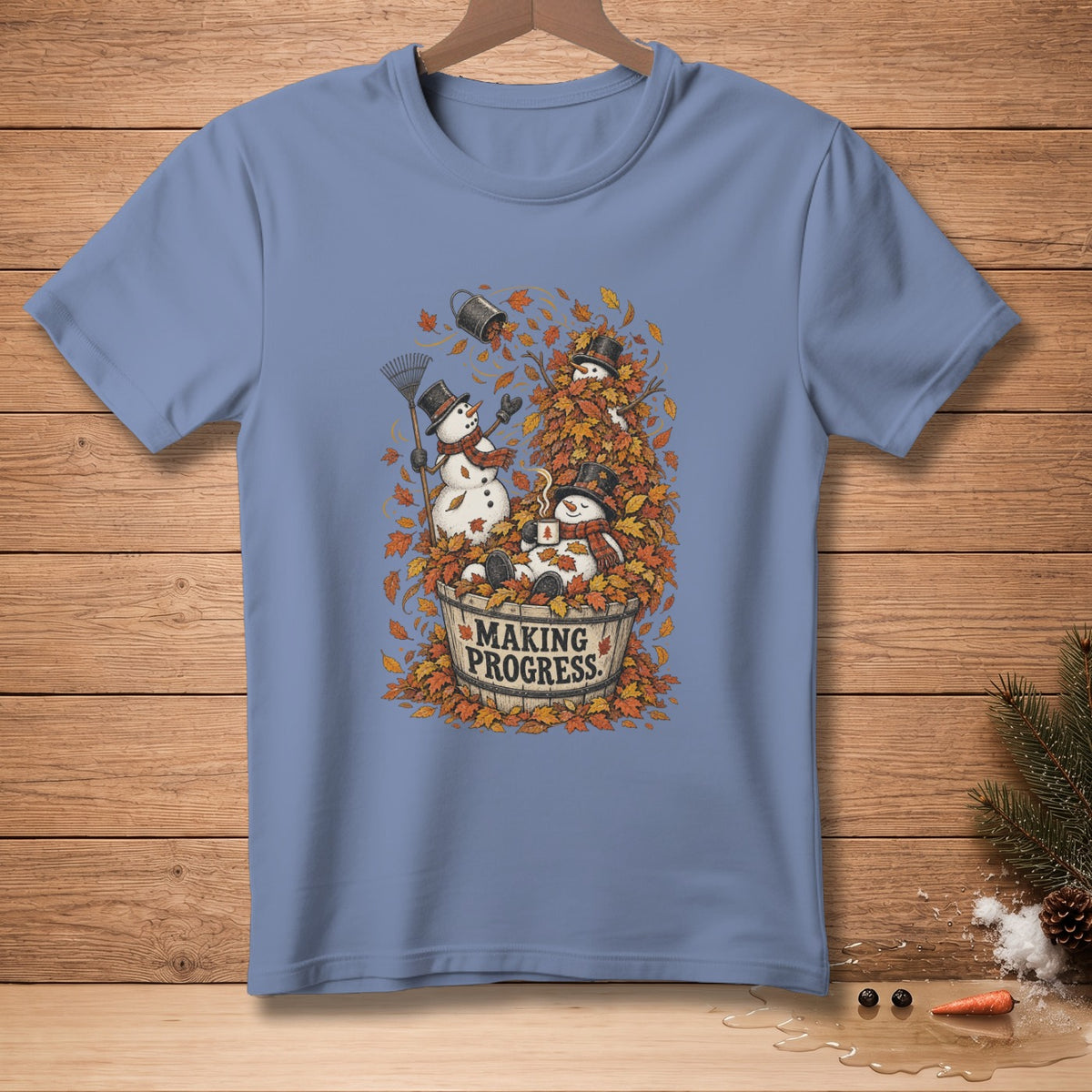 Snowmen in a bucket of autumn leaves with "MAKING PROGRESS" text.