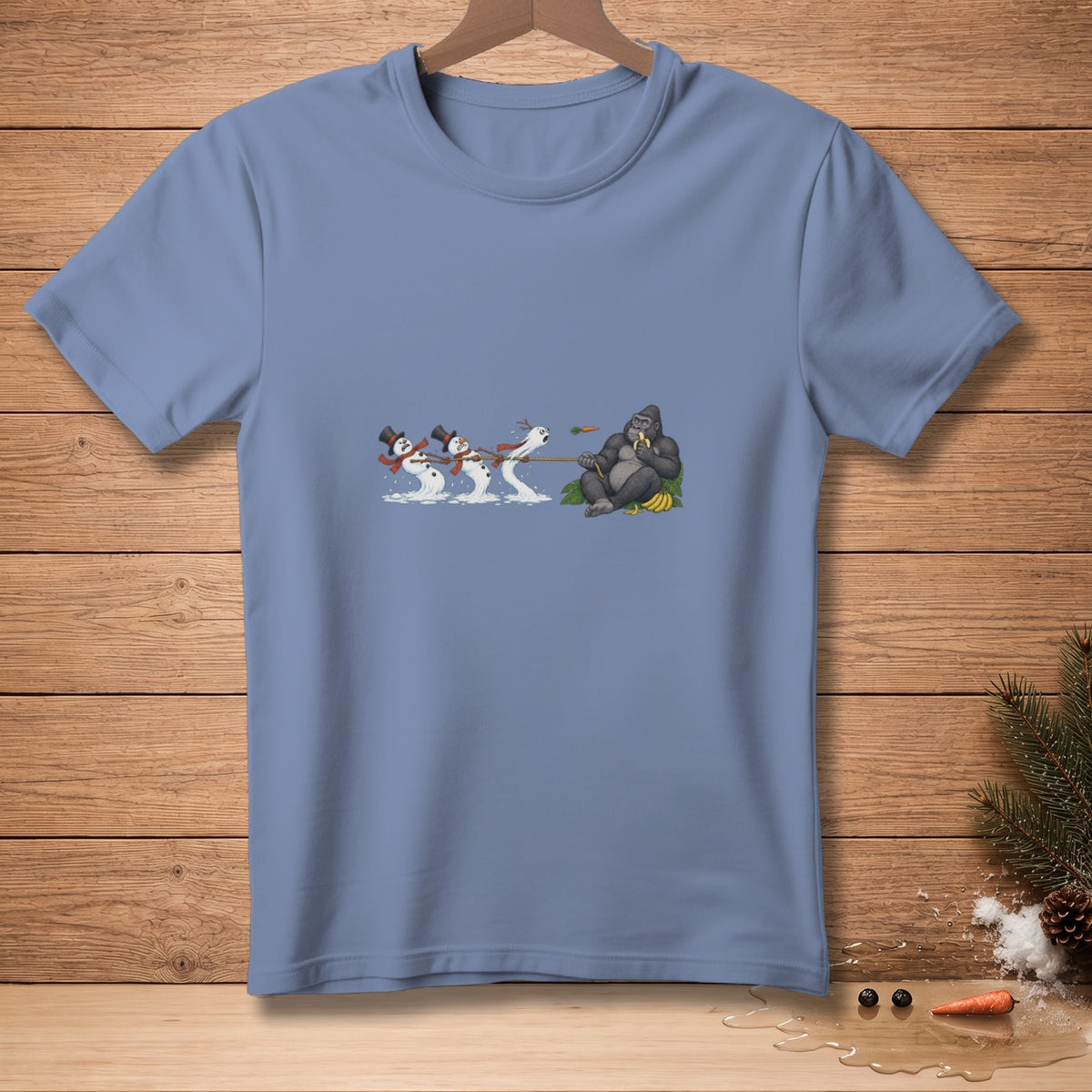 Snowmen pull a rope towards a gorilla sitting and eating a banana.