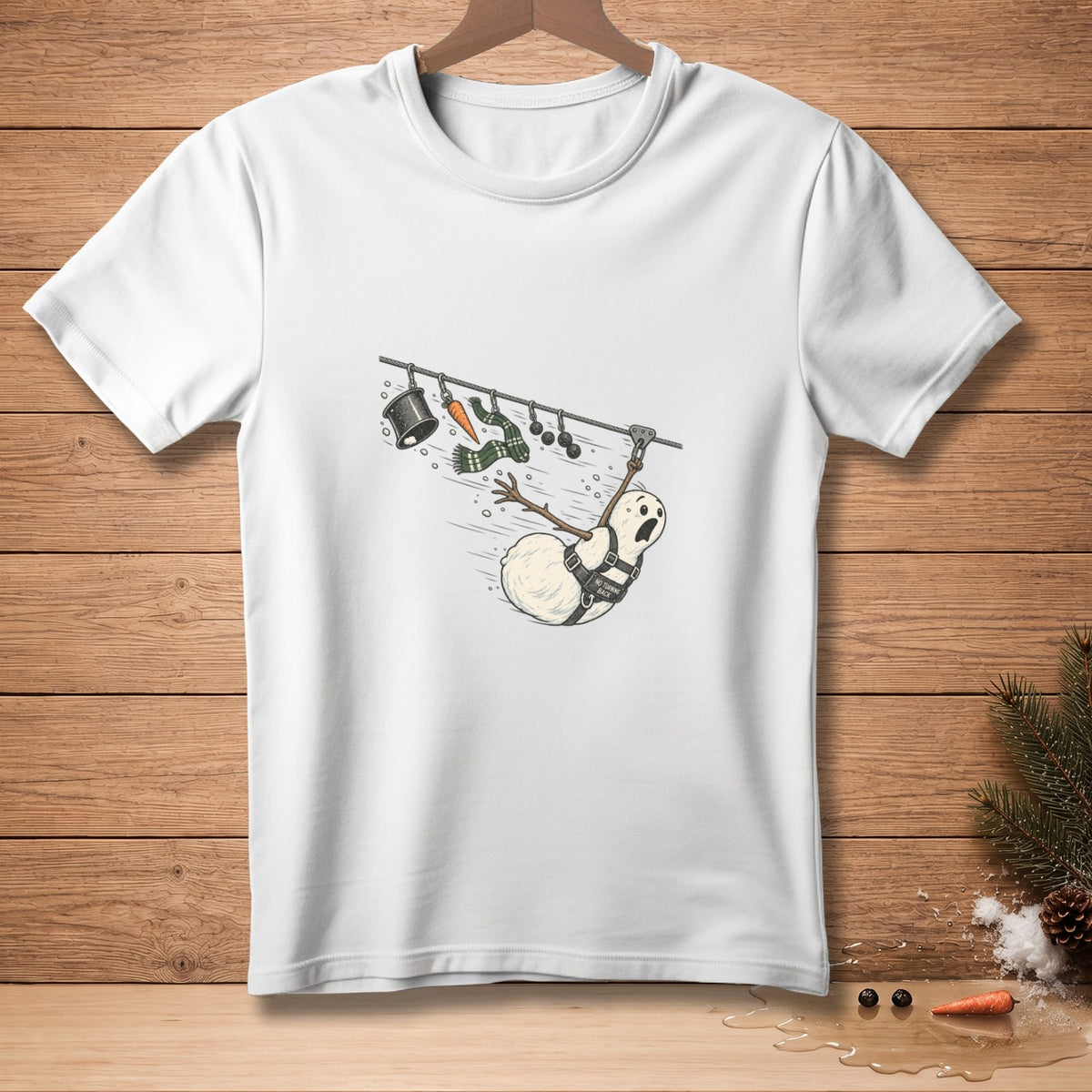 White t-shirt with cartoon snowman ziplining with text "No Turning Back."