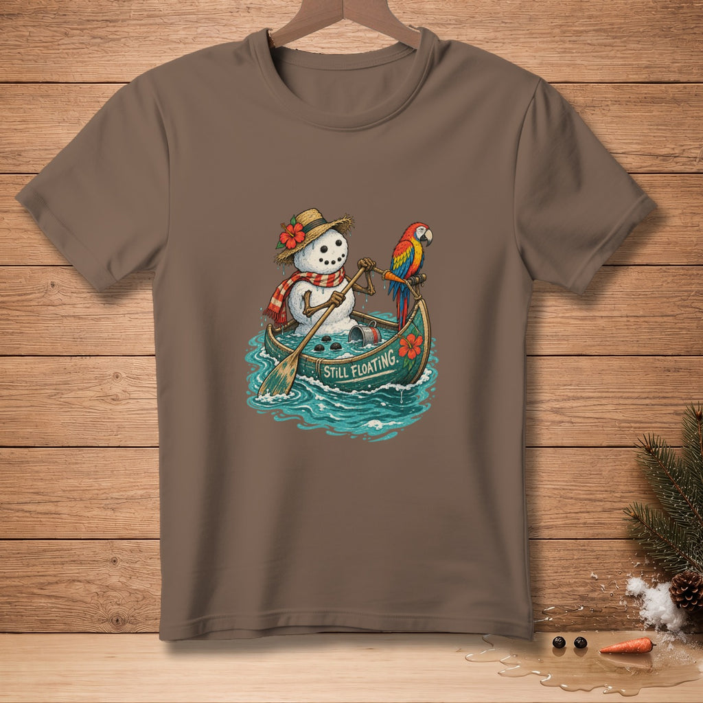 Snowman in a canoe with a parrot, text reads "STILL FLOATING".