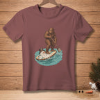 Bigfoot paddleboarding with a melting snowman on a surfboard.