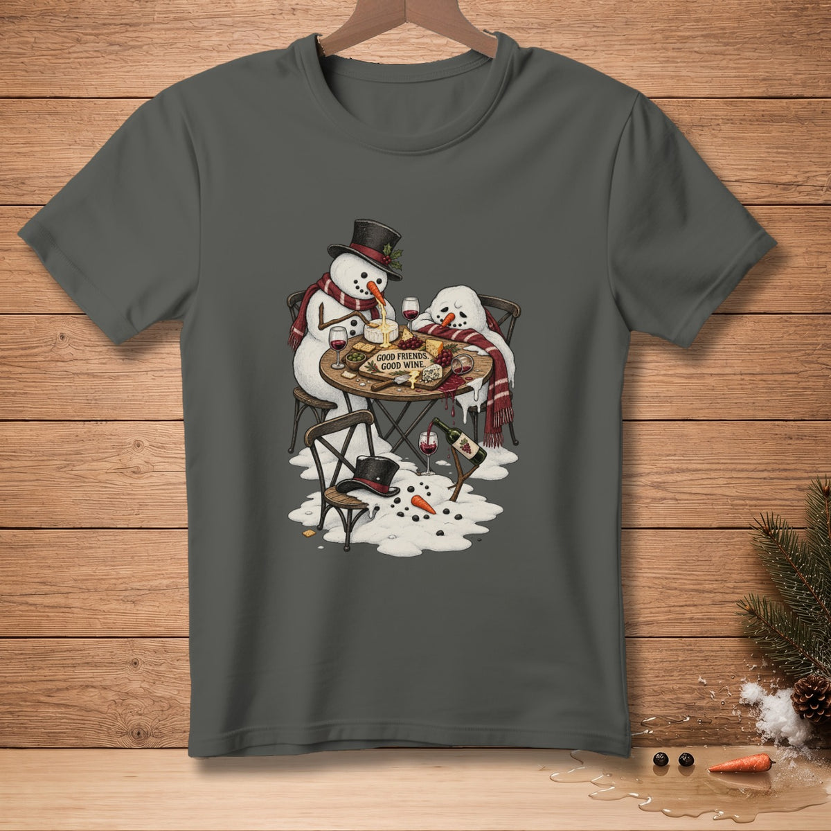 Two snowmen enjoy cheese and wine at a table, with text "GOOD FRIENDS, GOOD WINE."