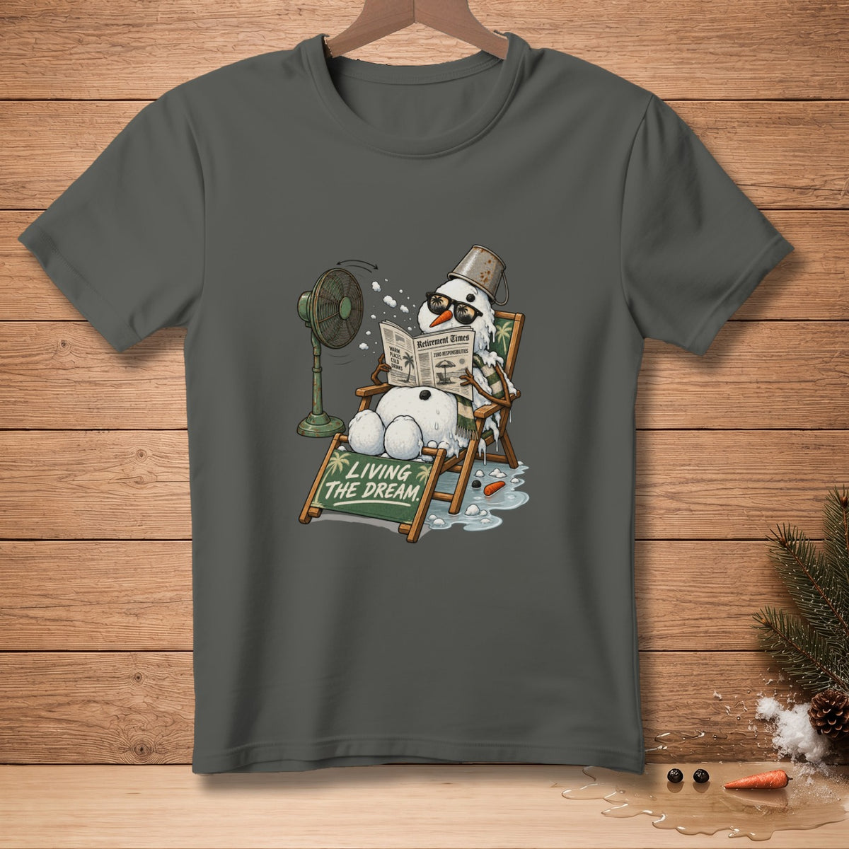 Snowman reading "Retirement Times" newspaper in a lounge chair with a fan.