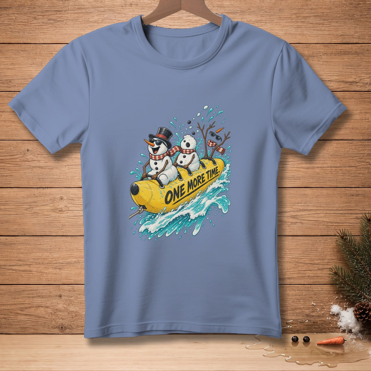 Snowmen riding a yellow banana boat with text "One More Time" on blue t-shirt.