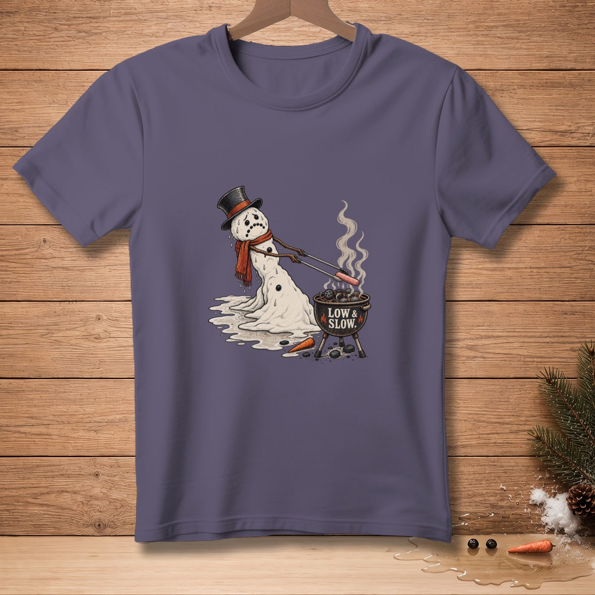Melting snowman with sad face grilling hot dogs with text "LOW & SLOW".