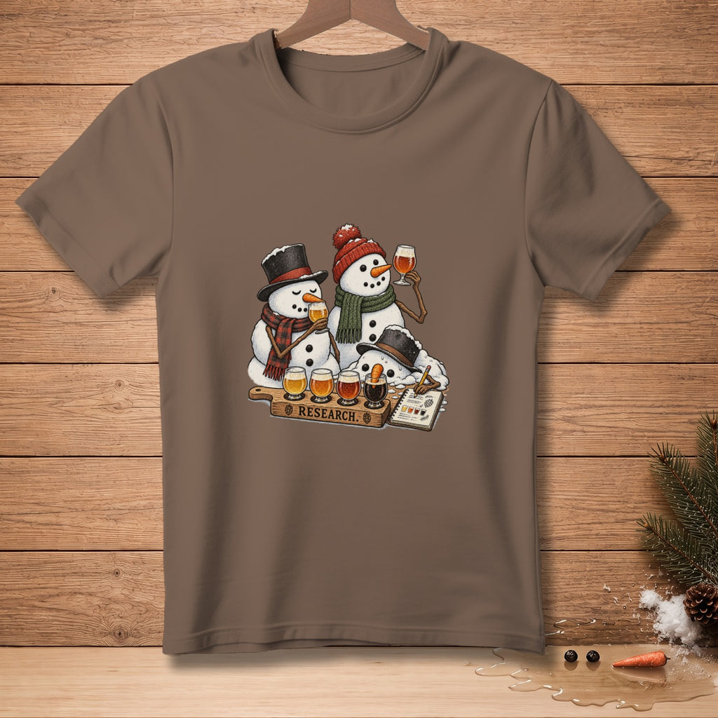 Three snowmen wearing hats and scarves taste beer on a wooden board with the word "RESEARCH."