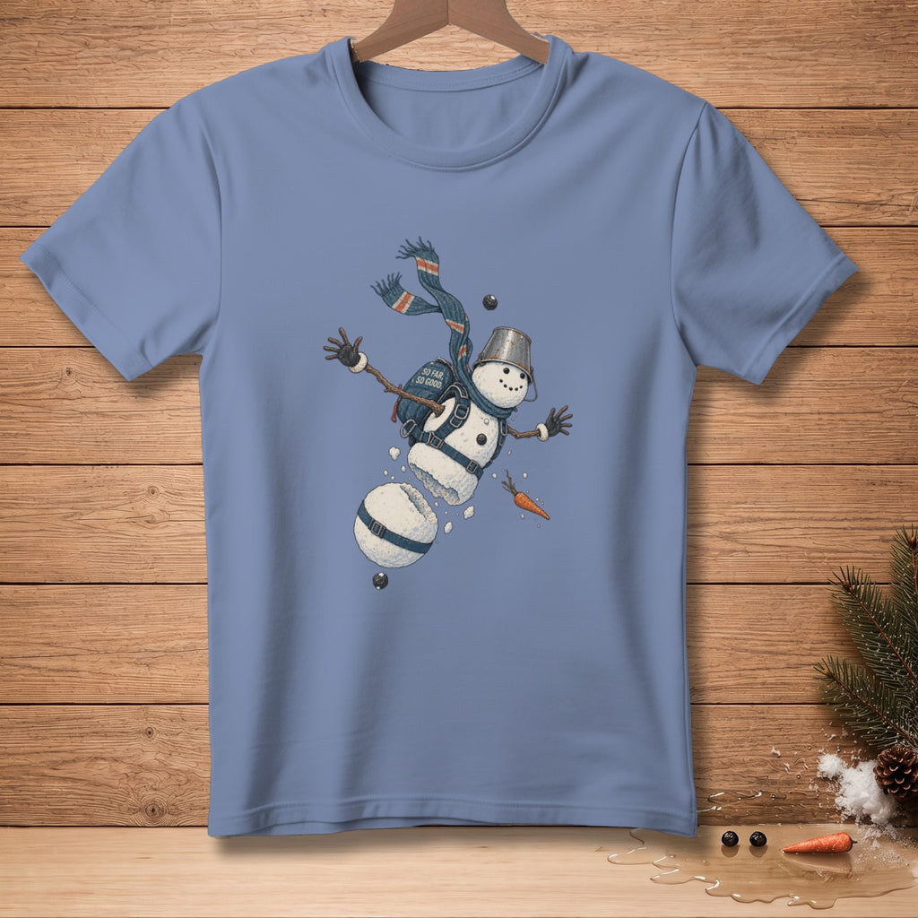 Blue t-shirt with falling snowman graphic featuring a bucket hat and scarf.