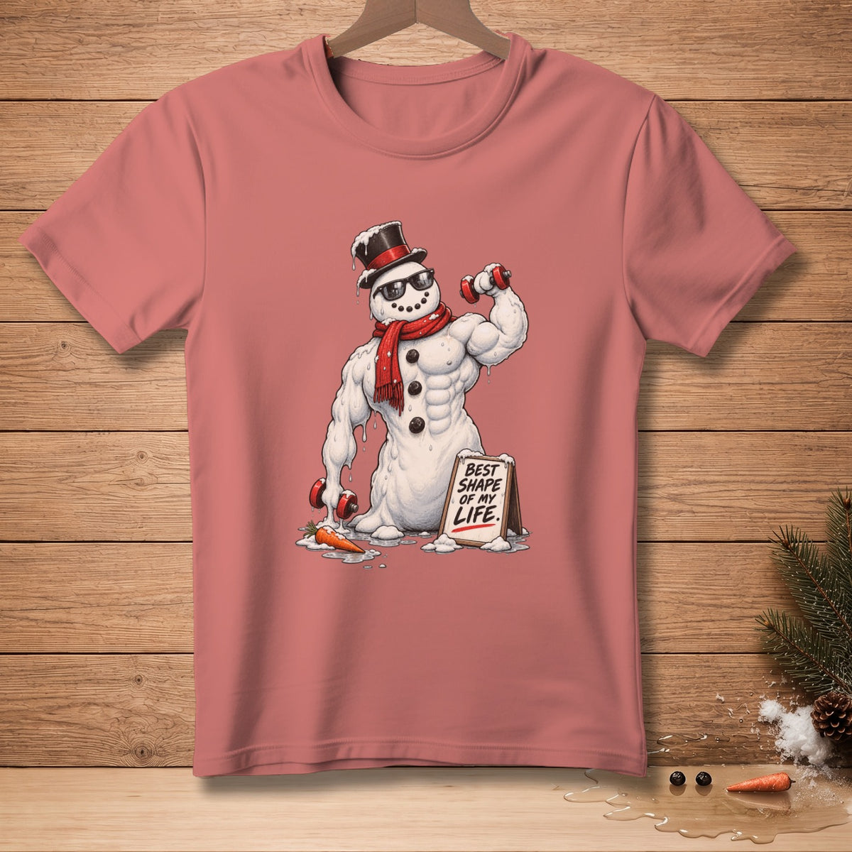 T-shirt featuring a muscular snowman holding dumbbells and a sign that reads "Best Shape of My Life."