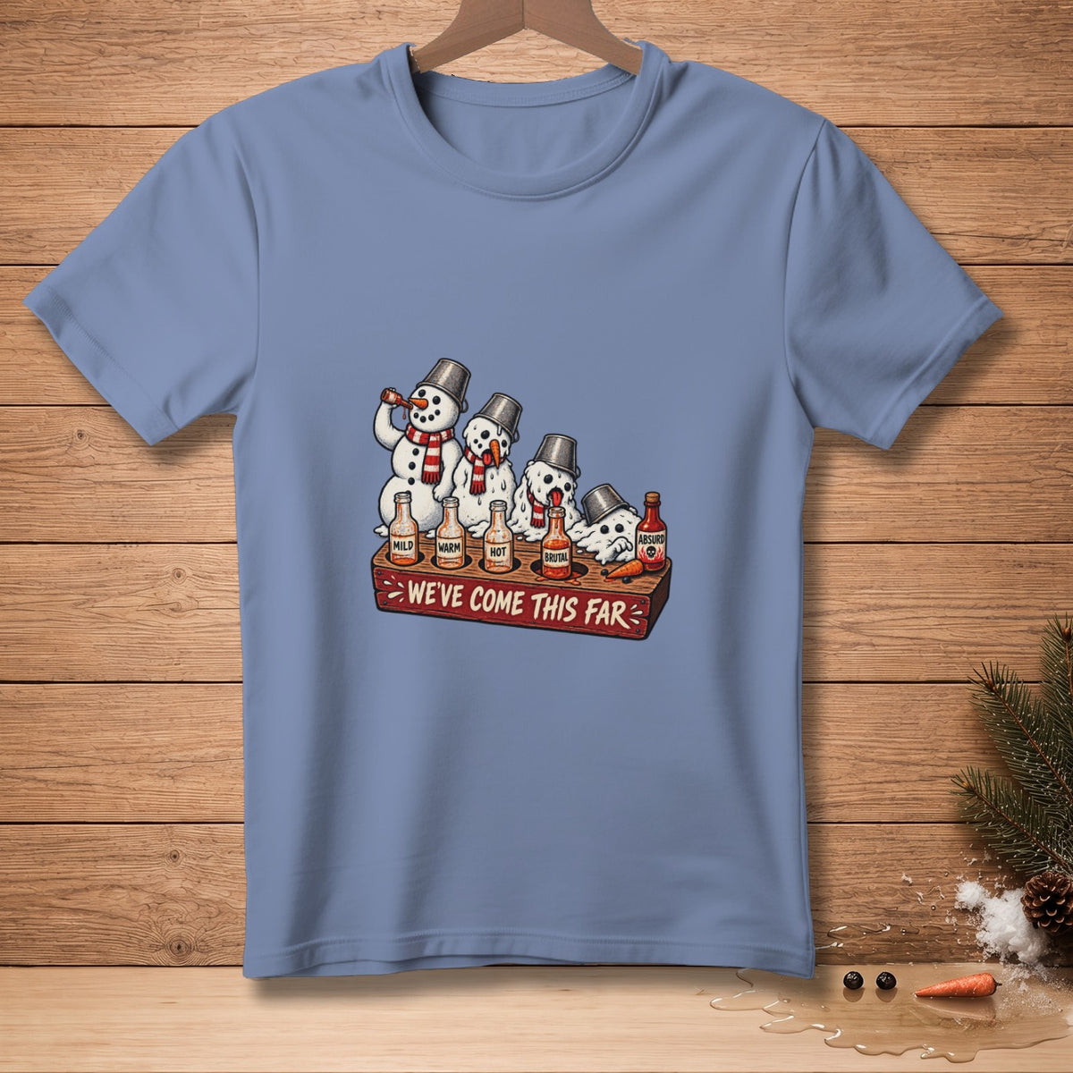 Snowmen drinking from hot sauce bottles labeled Mild, Warm, Hot, Brutal, Absurd.
