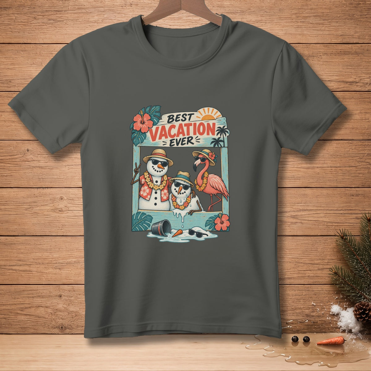 T-shirt graphic with two snowmen and a flamingo on a beach with text "BEST VACATION EVER".