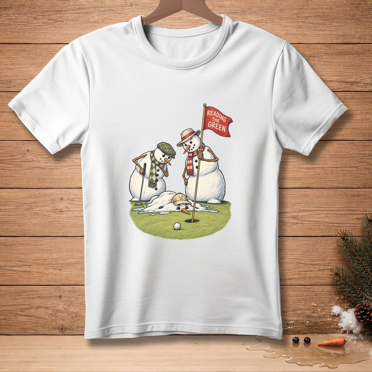 Two snowmen are on a golf green with a melting snowman and flag that reads "READING THE GREEN".
