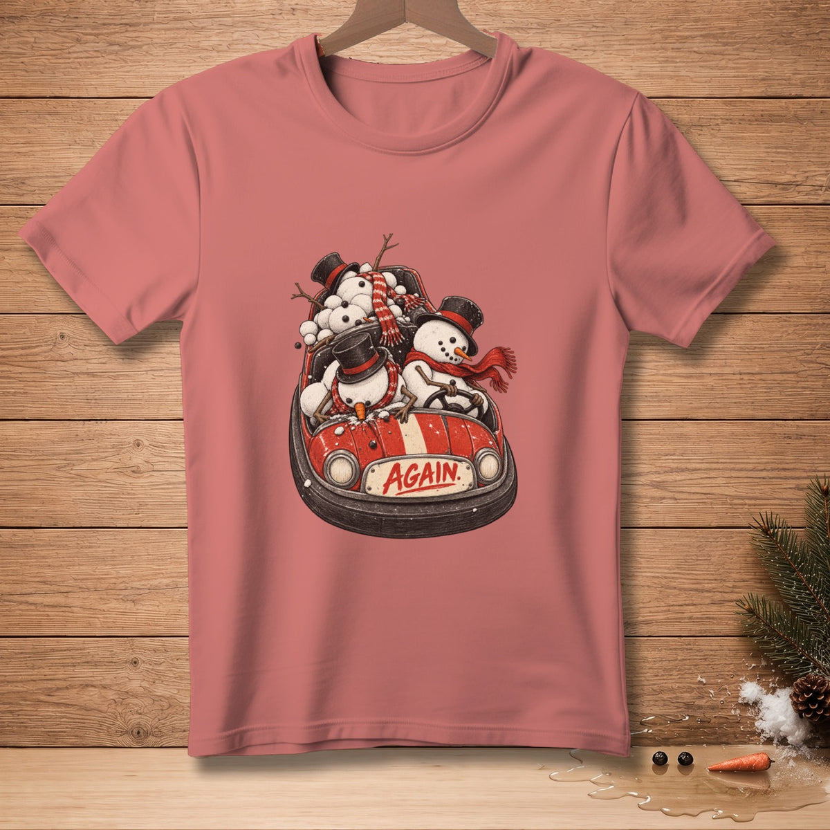 T-shirt with snowmen wearing hats and scarves in a red bumper car with the word "AGAIN".
