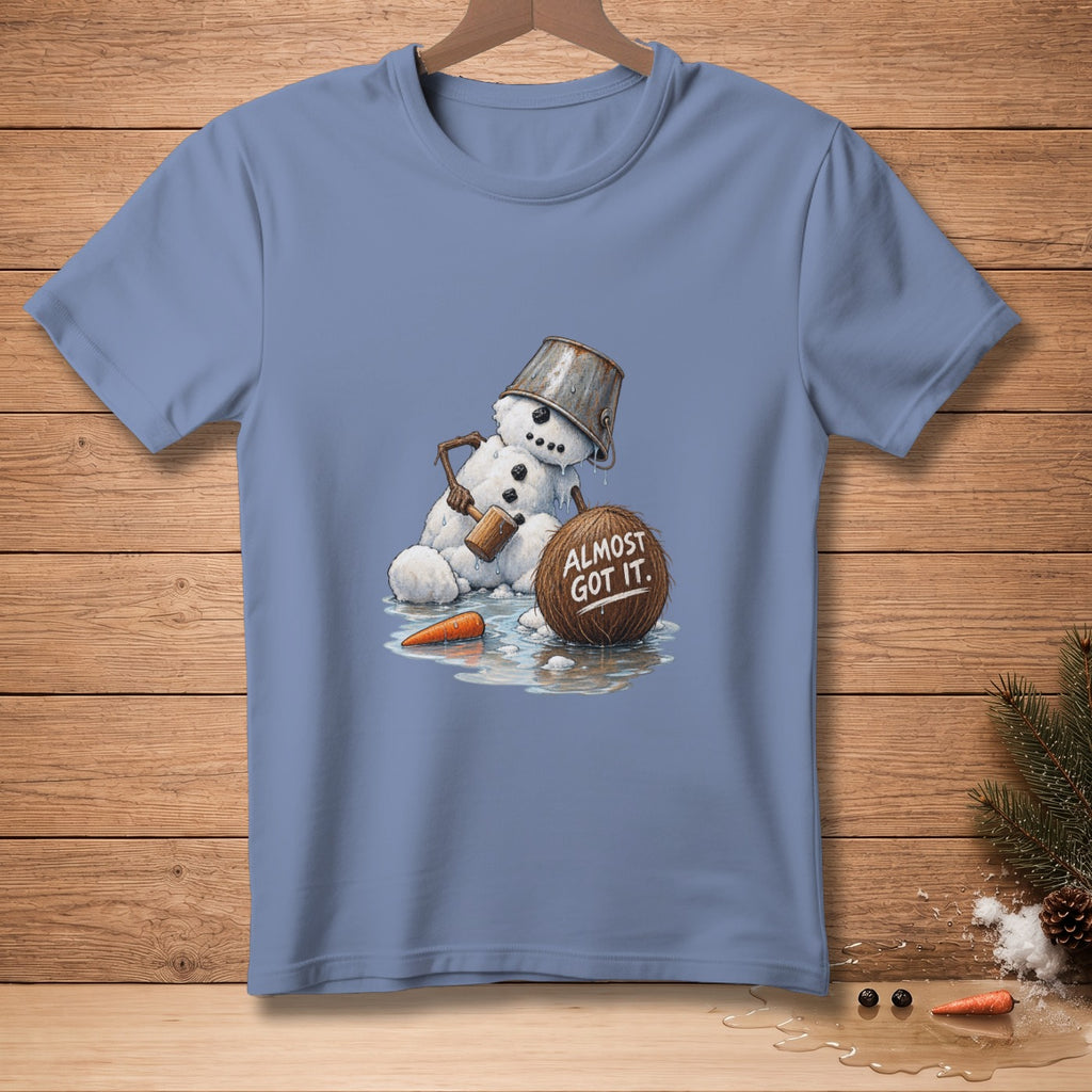 Melting snowman with bucket hat, carrot, and coconut reading "Almost Got It."