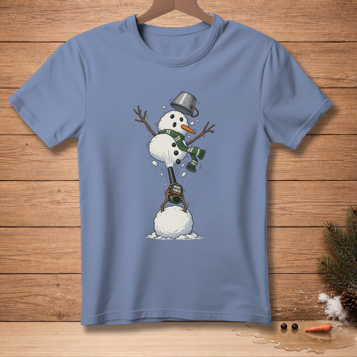 Snowman with bucket hat and scarf operating a leaf blower with "More Power" text.