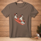 Two snowmen on a sled with text "DON'T DROP IT" on a brown t-shirt.