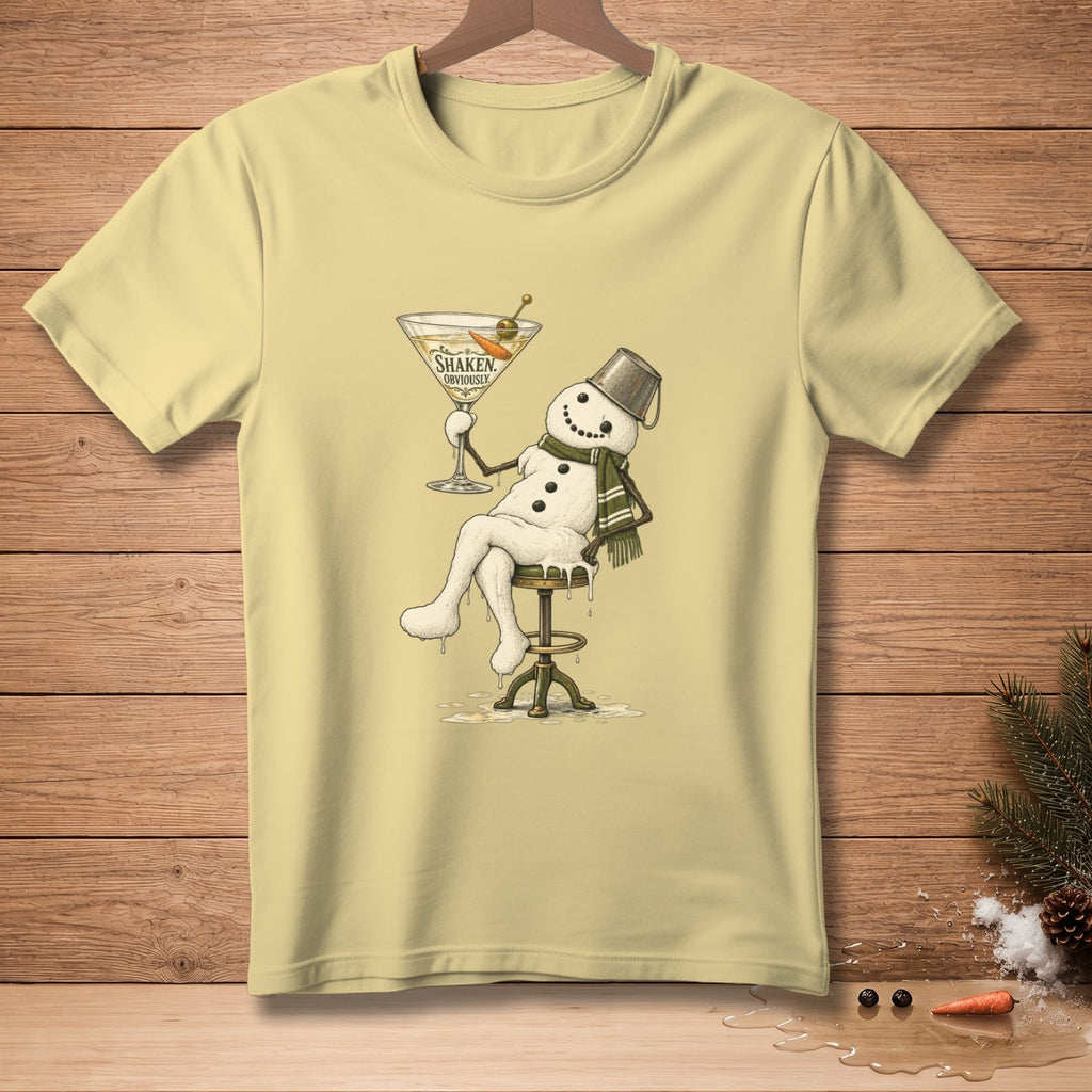 Snowman with bucket hat, scarf, and martini on stool, text reads "Shaken, Obviously".