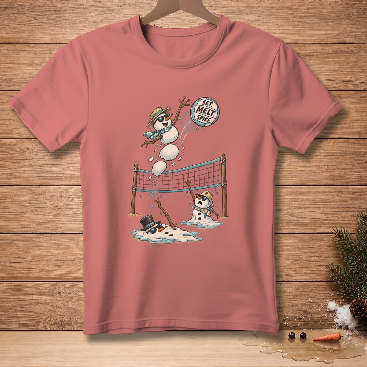 T-shirt with cartoon snowmen playing volleyball, text reads "Set. Melt. Spike."