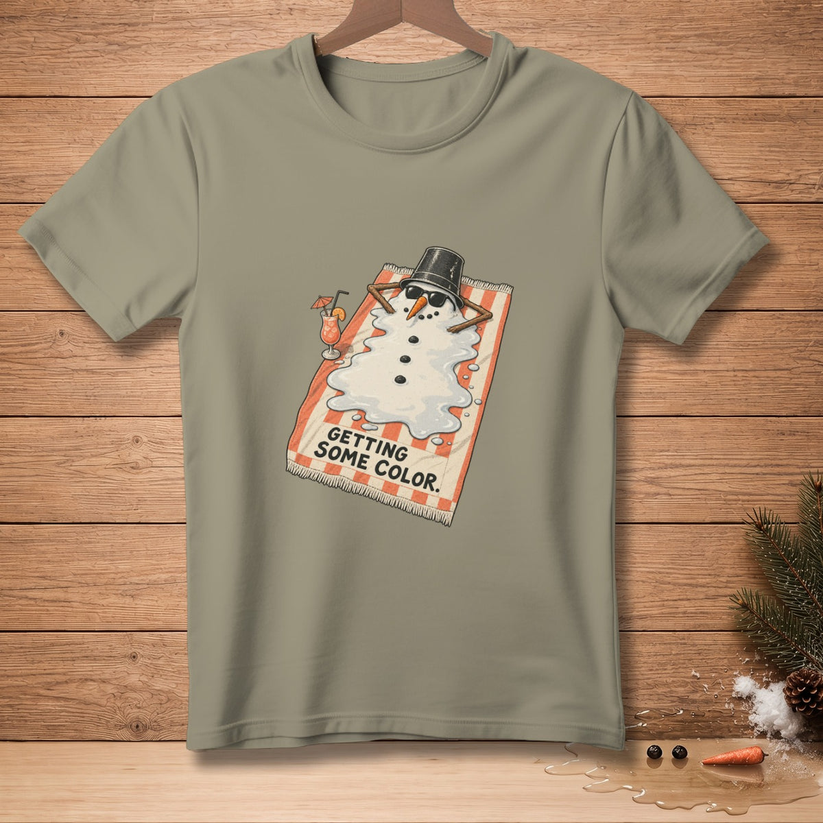 Melting snowman on beach towel wearing sunglasses and bucket hat, text "GETTING SOME COLOR."