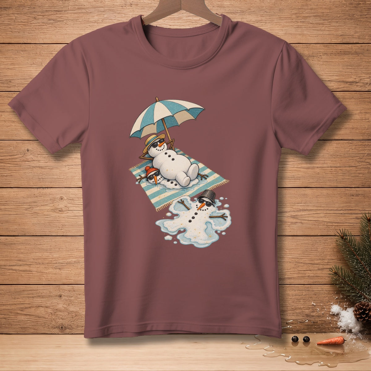 Snowmen melting on a beach towel under an umbrella with sunglasses.