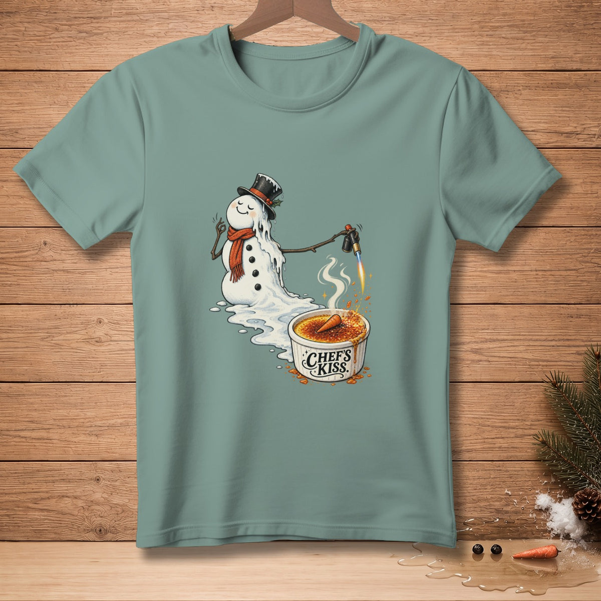 Melting snowman with a blowtorch caramelizing creme brûlée with "Chef's Kiss" text.