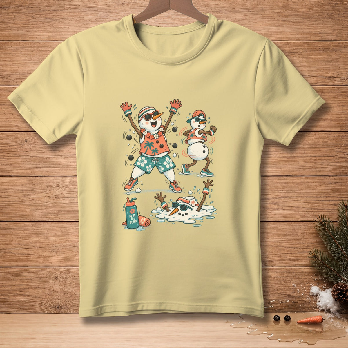 T-shirt with cartoon snowmen running and melting on a beach.