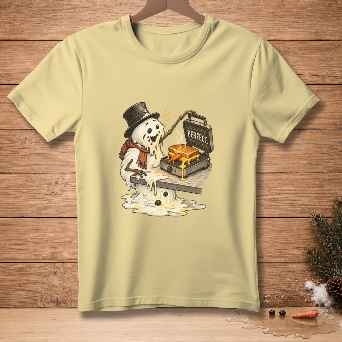 Melting snowman with a top hat and scarf making a grilled cheese sandwich that says "PERFECT".