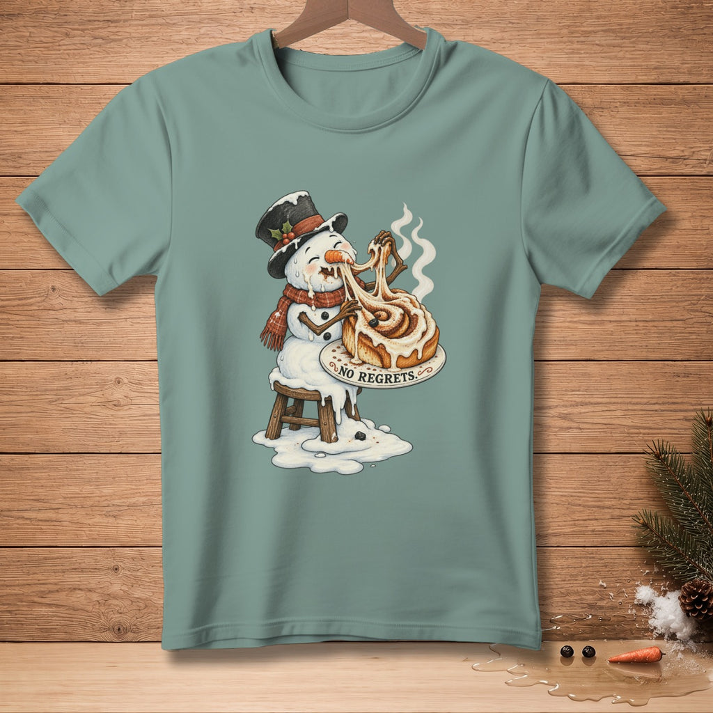 Snowman melting and eating a large cinnamon roll with "NO REGRETS" text.