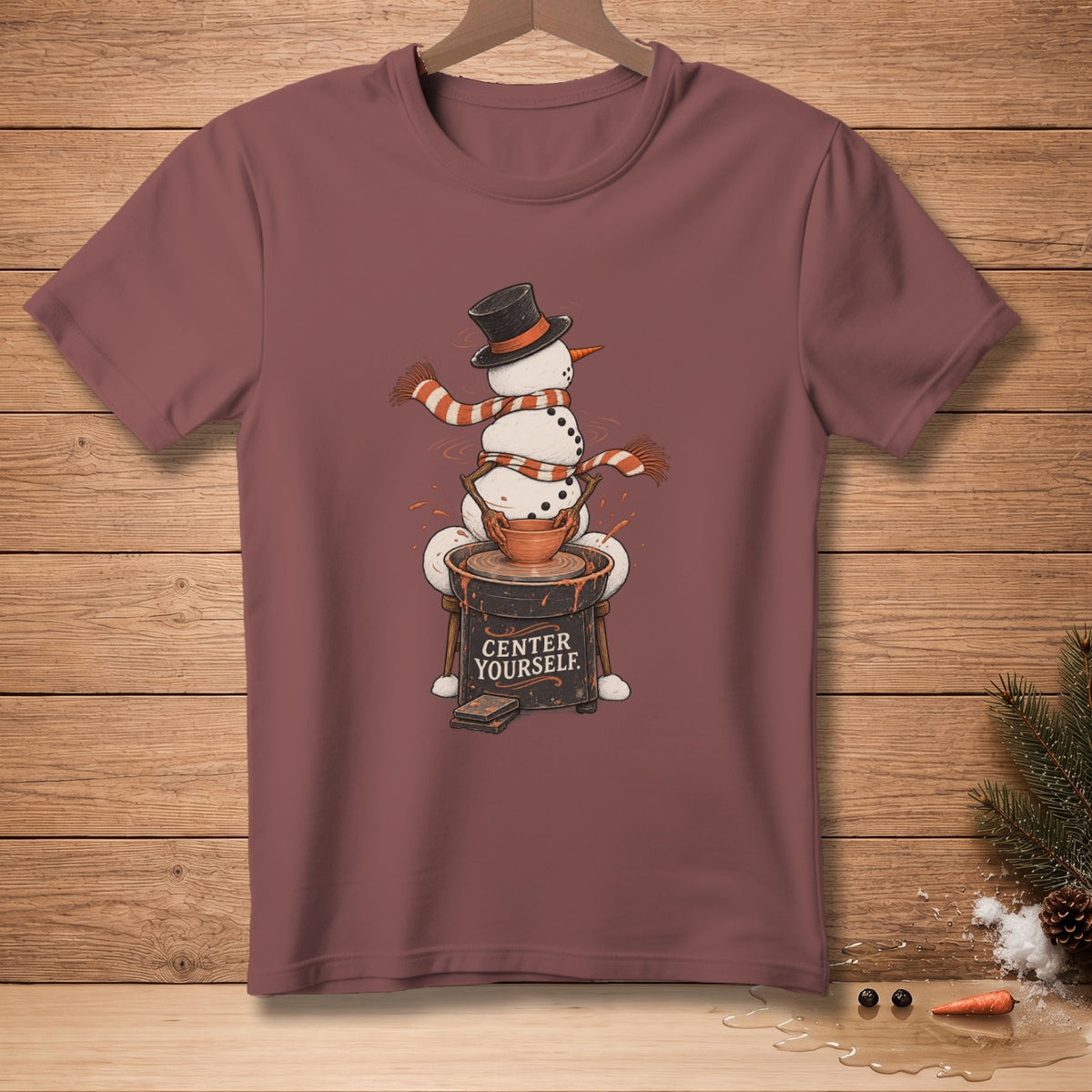 Snowman on pottery wheel with text "CENTER YOURSELF" printed on it.