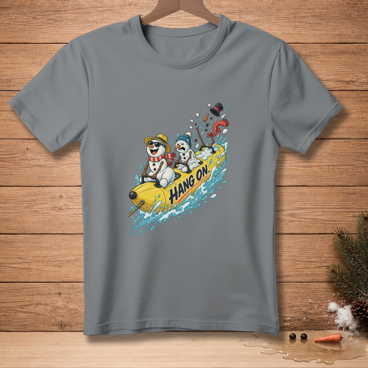 Two snowmen riding a yellow tube with "Hang On" text through splashing water.