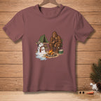 Bigfoot roasts marshmallow by campfire with melting snowman and tent.