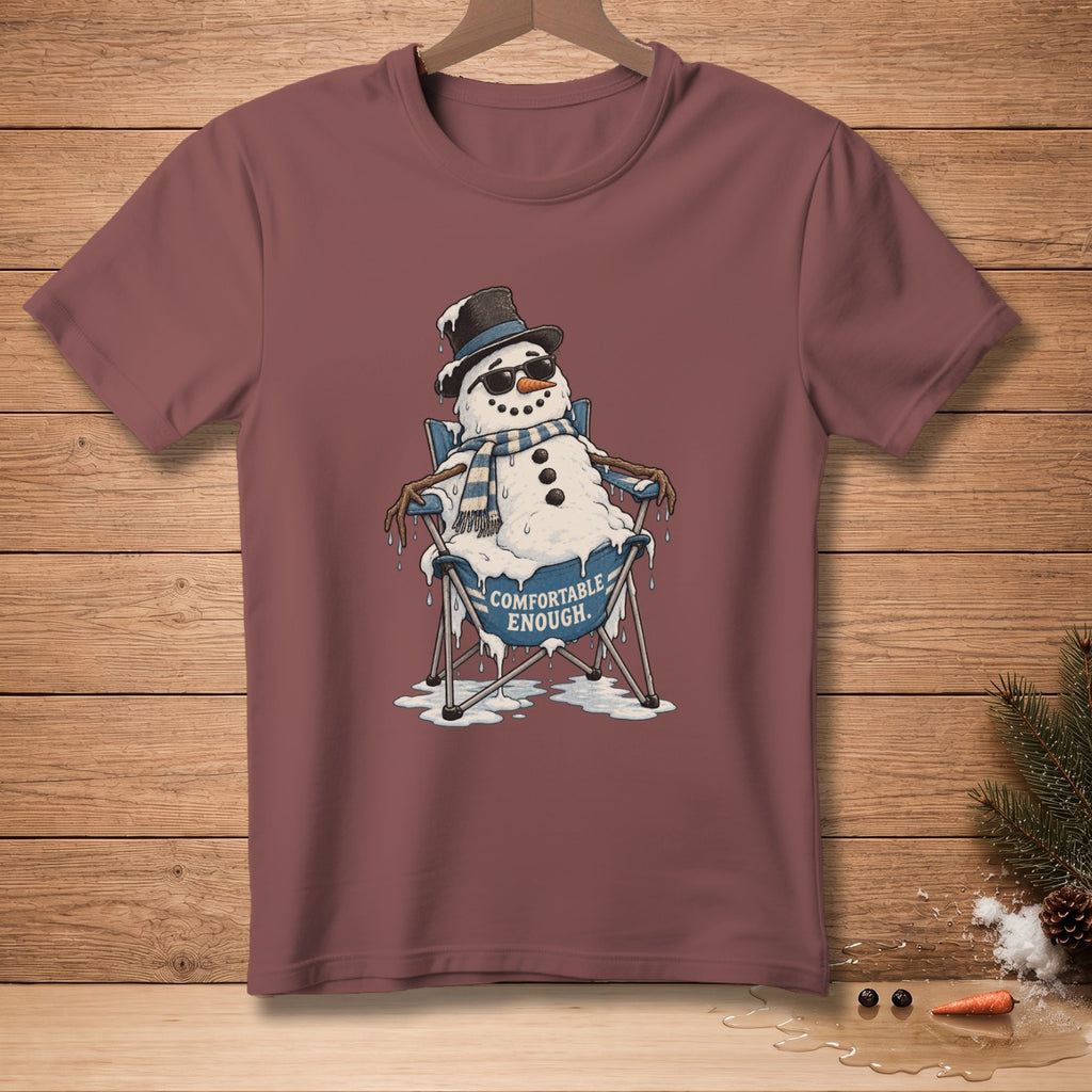 Melting snowman in sunglasses and hat sits in a chair with text "COMFORTABLE ENOUGH."