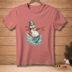T-shirt with a graphic of a snowman surfing a surfboard with text "STILL UP".