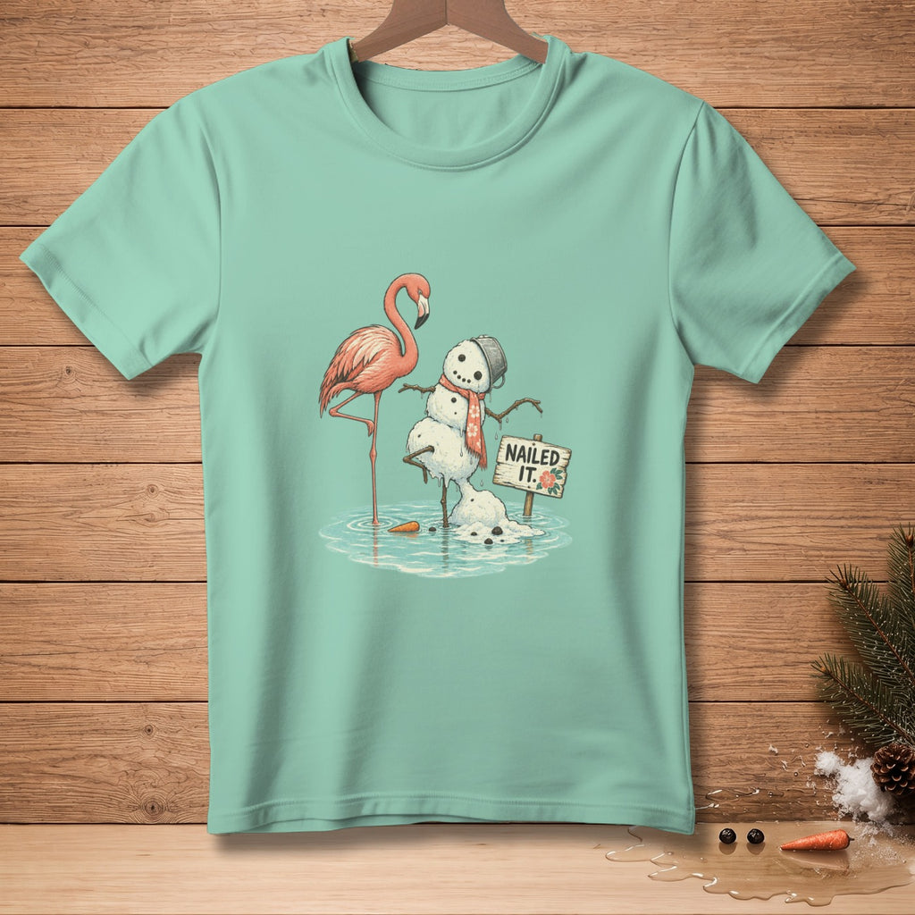 Flamingo and melting snowman with "NAILED IT." sign on teal t-shirt.