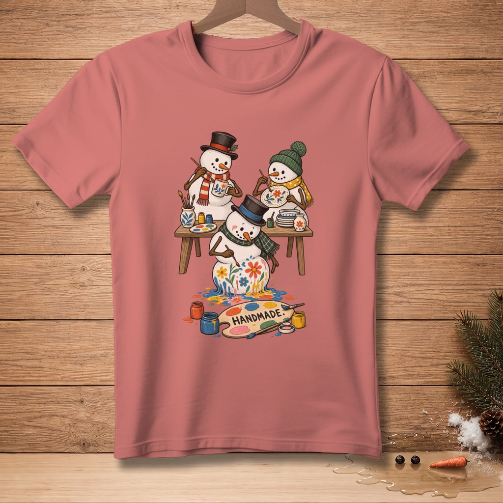 Three snowmen paint plates and mugs with colorful flowers; text reads "HANDMADE."