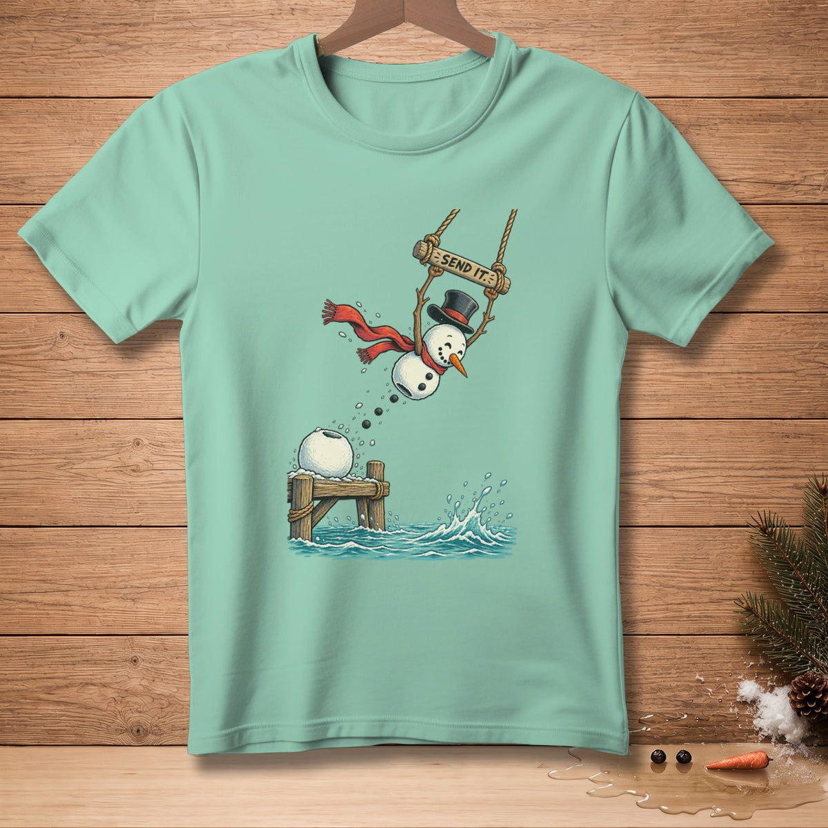 Snowman in top hat and scarf on swing labeled "SEND IT," jumping into water.