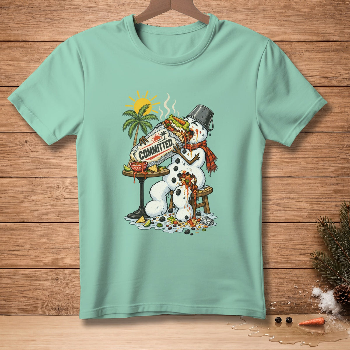 Snowman eating a giant burrito labeled "COMMITTED" on a tropical beach.