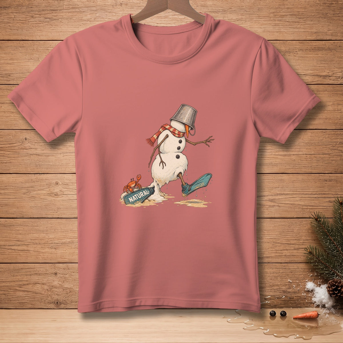 Melting snowman wearing scarf and bucket hat, with crab on board labeled "NATURAL".