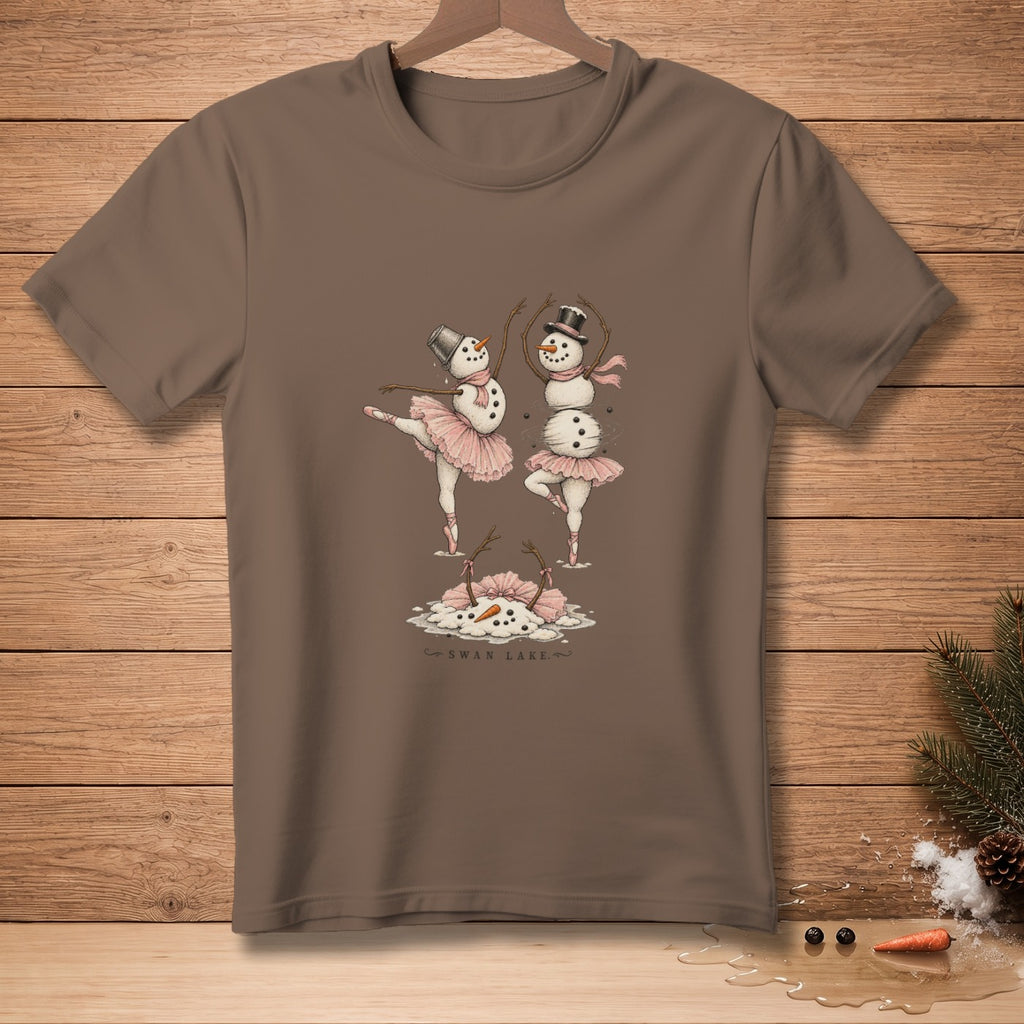 Two snowmen in ballet tutus dance on a brown t-shirt with "Swan Lake" text.