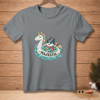 Gray t-shirt with a graphic of a snowman on a unicorn float, text "MAJESTIC".