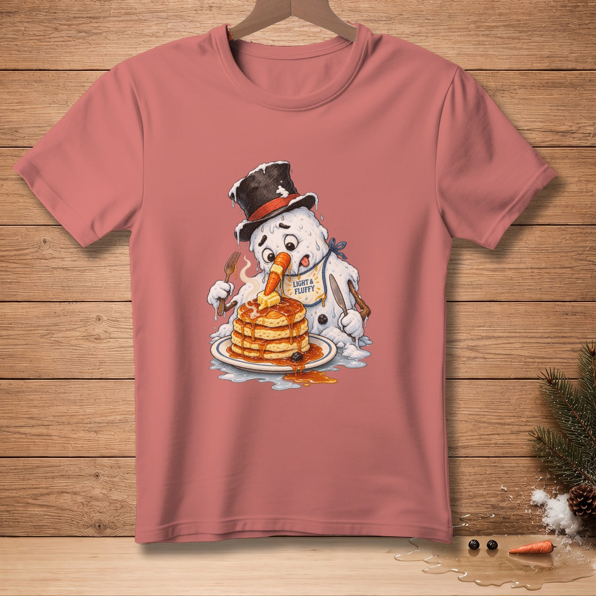 Snowman eating pancakes with "Light & Fluffy" bib.