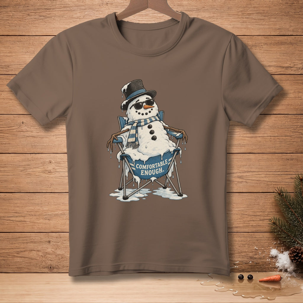 T-shirt featuring a melting snowman wearing sunglasses and a hat, sitting in a chair with "Comfortable Enough" text.