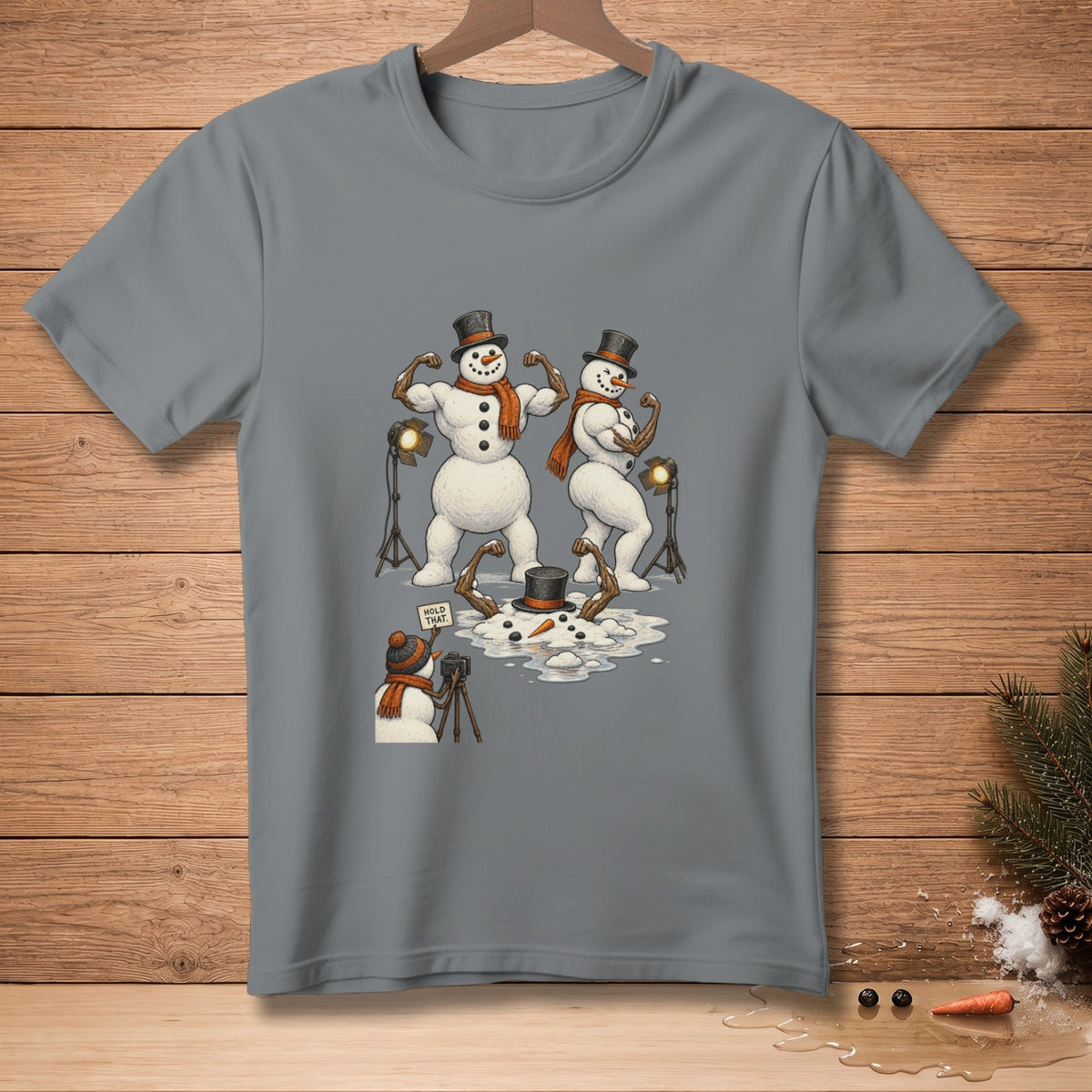 Muscular snowmen posing for a photo while a snowman photographer holds up a "Hold That" sign.