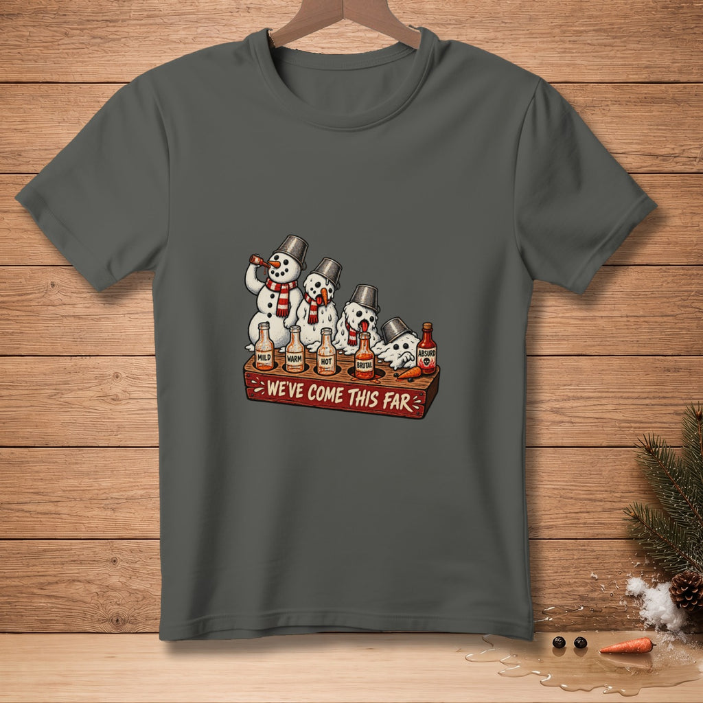 Four snowmen lined up with buckets on their heads and bottles of hot sauce.