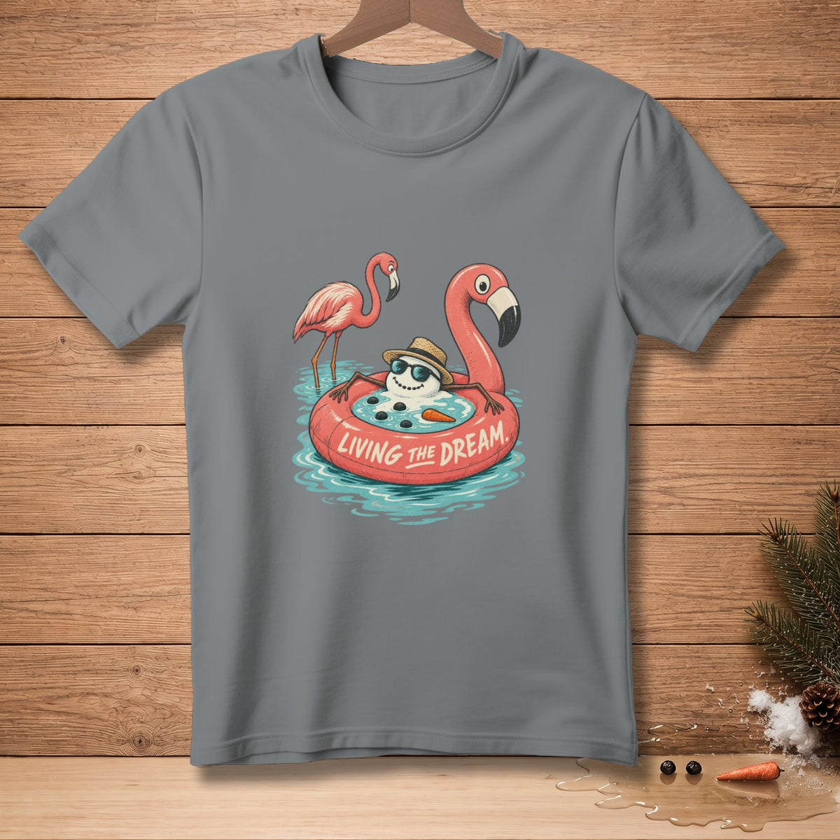 T-shirt with cartoon of a snowman on a flamingo float saying "Living the Dream".