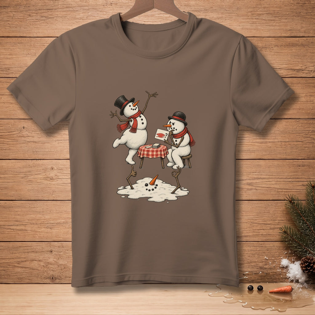 Two snowmen, one melting, interact at a small table on a taupe t-shirt.