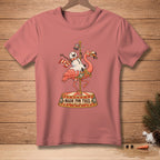 Pink t-shirt with a Christmas flamingo and snowman riding a carousel with "Made for This" text.