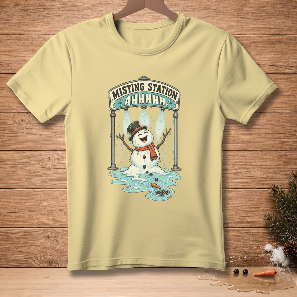 Yellow t-shirt with melting snowman under a "Misting Station AHHHHH" sign.