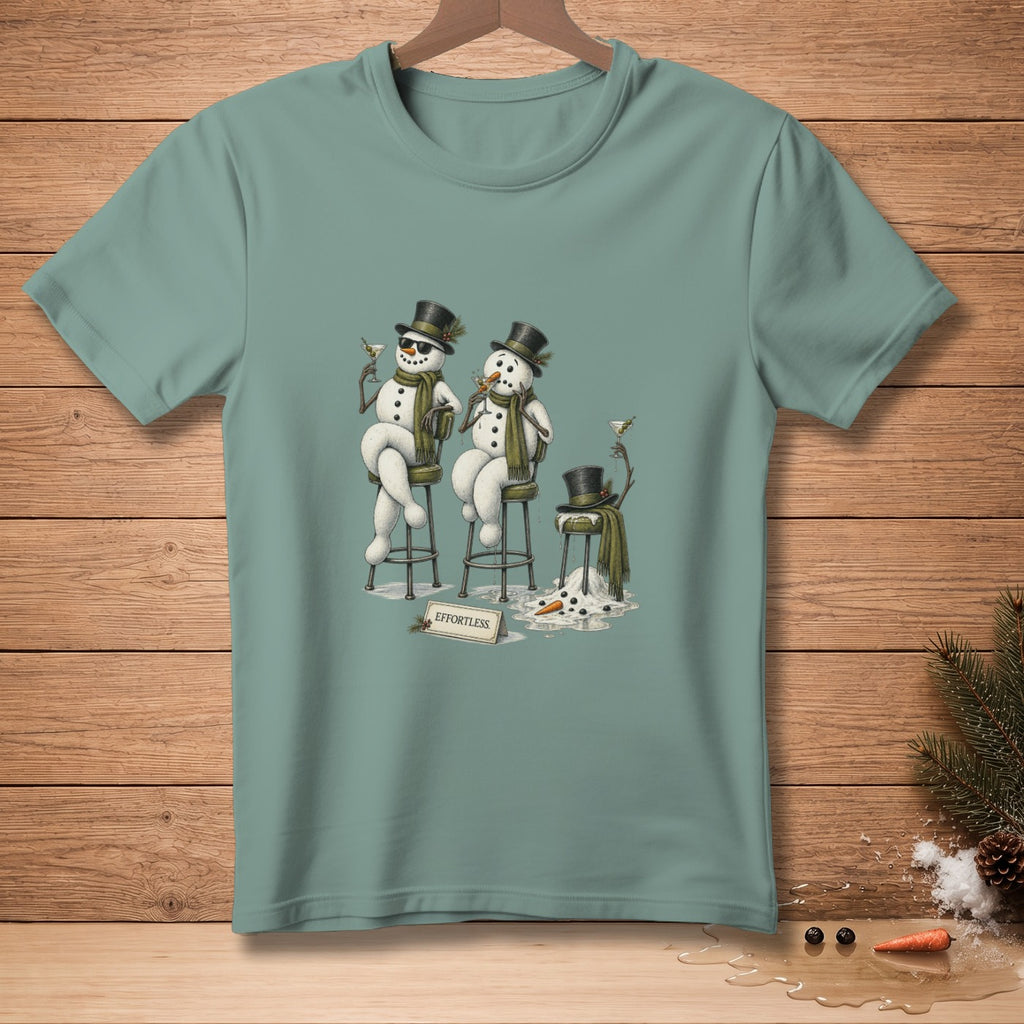 Two snowmen in top hats and scarves sit at bar stools with martinis.