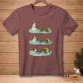 T-shirt graphic of an alligator playfully splashing a snowman in water.